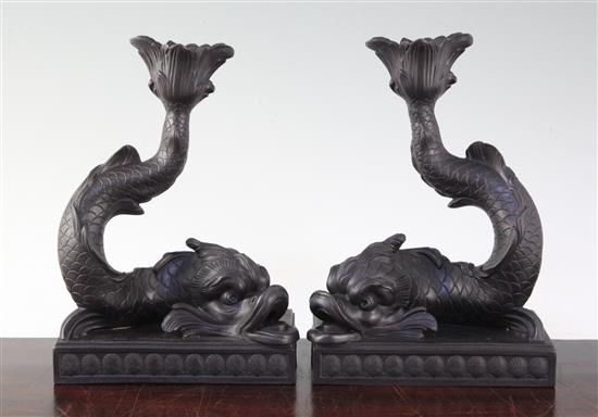 A pair of Wedgwood black basalt dolphin candlesticks, 21.5cm